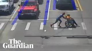 Driver dressed as Spider-Man helps man in wheelchair cross road