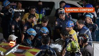 At least 27 killed in Bangkok pub fire, officials say