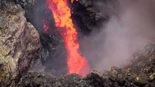 Drone video shows Etna lava pour into neighboring summit crater