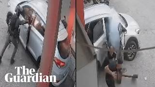 CCTV video shows Israeli border police officer throwing stun grenade into a car