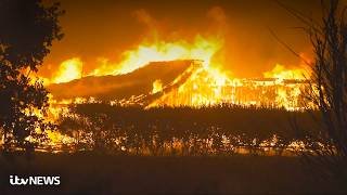 Wildfire engulfs homes as thousands flee tourist hotspot in south of France