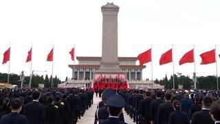Xi Jinping presents flower baskets to fallen national heroes at Tiananmen Square