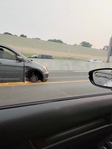 Minivan Scrapes Along Road After Wheel Falls Off