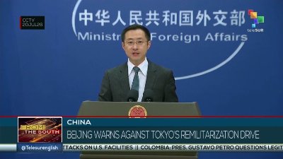China warns against Japan's remilitarization drive