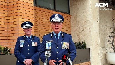 Commissioner Lanyon speaks to the media