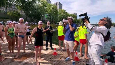 France: hundreds dive into the Seine for Paris’ first river race in 80 years
