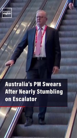 Australia’s PM Swears After Nearly Stumbling on Escalator