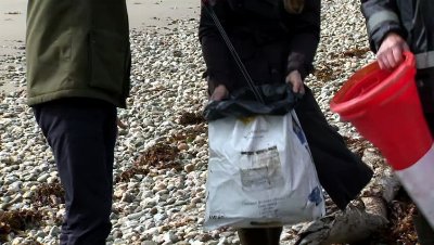 Prince and Princess of Wales help clean up beach